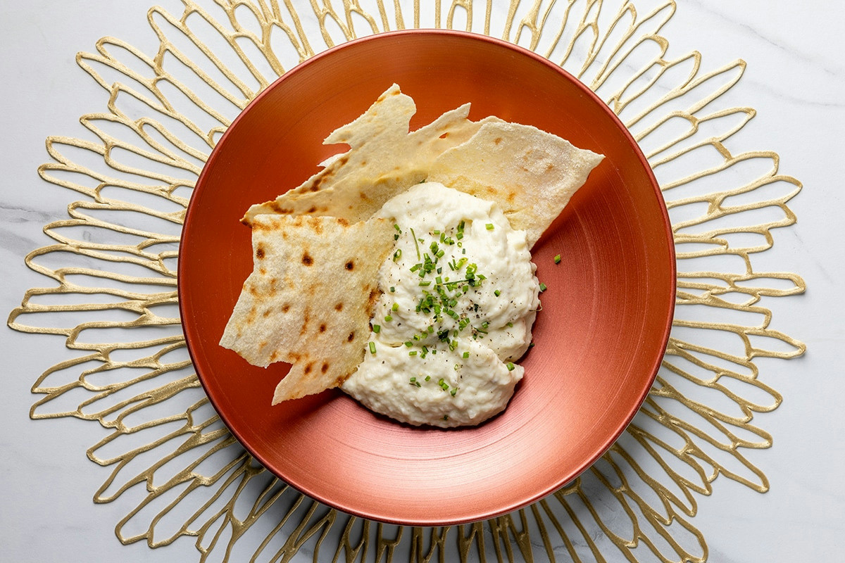 Crema di baccalà al profumo di limone e fava di tonka: un tocco esotico per palati raffinati